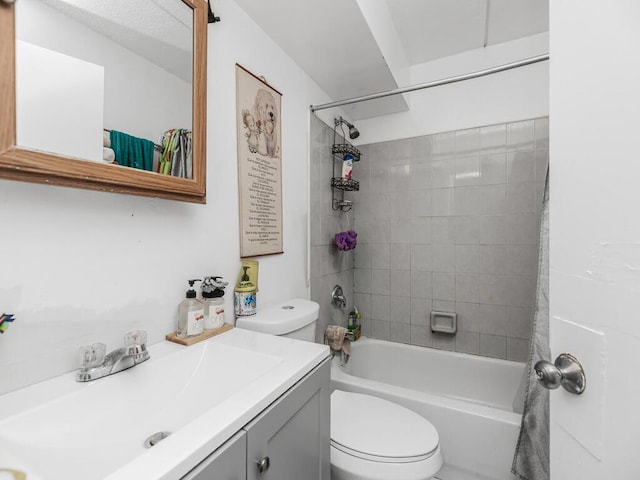 full bathroom with vanity, toilet, and tiled shower / bath