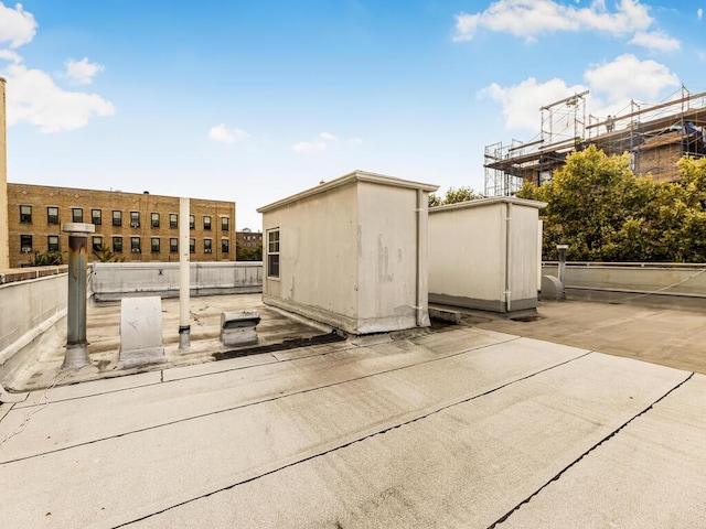 view of patio with a storage unit