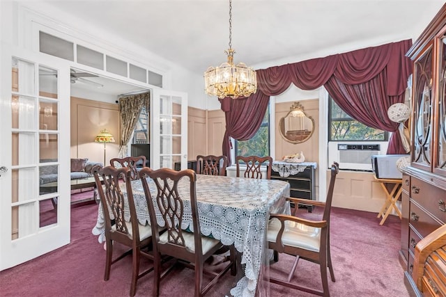 dining room with cooling unit, carpet, and ceiling fan with notable chandelier