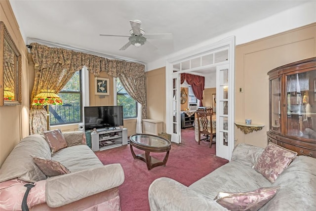 carpeted living room featuring ceiling fan