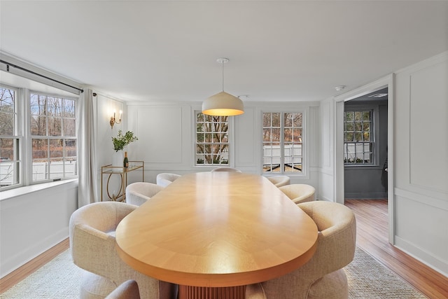 dining area featuring a healthy amount of sunlight and light wood-type flooring