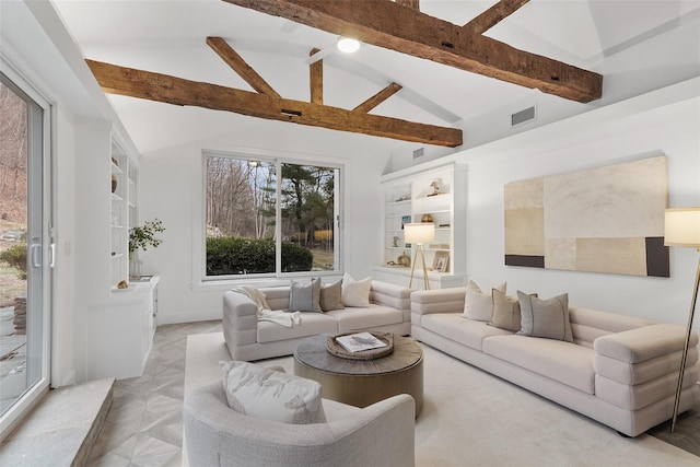 living room with beamed ceiling and high vaulted ceiling