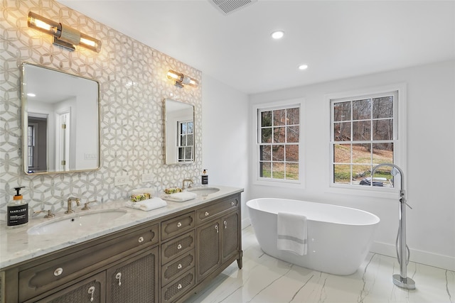 bathroom featuring a bathtub and vanity