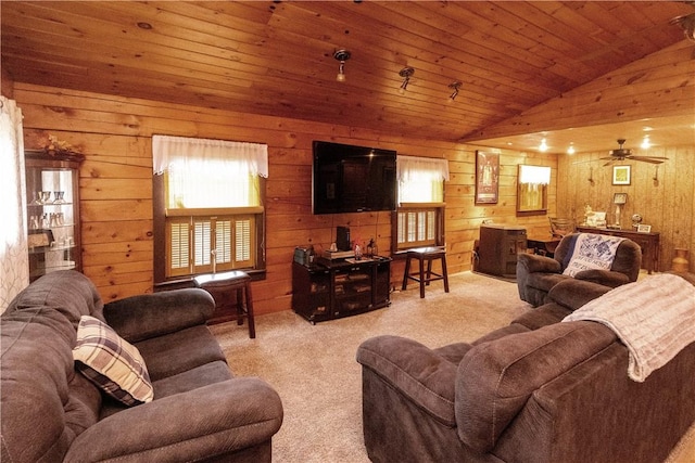 carpeted living room featuring wood walls, ceiling fan, wood ceiling, and lofted ceiling