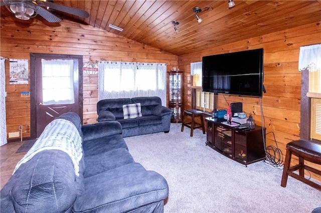 carpeted living room featuring wood walls, ceiling fan, wooden ceiling, and vaulted ceiling