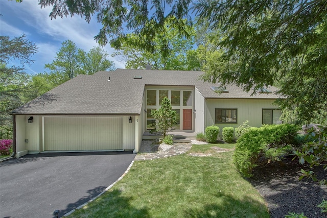 7 High Point Cir, Chappaqua, NY 10514 - mid-century home with roof with shingles, an attached garage, a front yard, and asphalt driveway