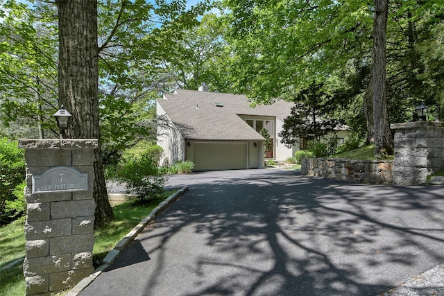 7 High Point Cir, Chappaqua, NY 10514 - view of front facade with asphalt driveway, a garage, and a shingled roof