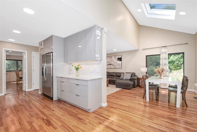 7 High Point Cir, Chappaqua, NY 10514 - kitchen with gray cabinetry, stainless steel refrigerator with ice dispenser, modern cabinets, light wood-type flooring, and recessed lighting