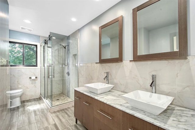 7 High Point Cir, Chappaqua, NY 10514 - full bath featuring tile walls, a stall shower, toilet, double vanity, and recessed lighting