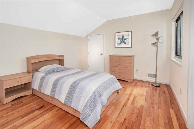 7 High Point Cir, Chappaqua, NY 10514 - bedroom with light wood finished floors, vaulted ceiling, and baseboards