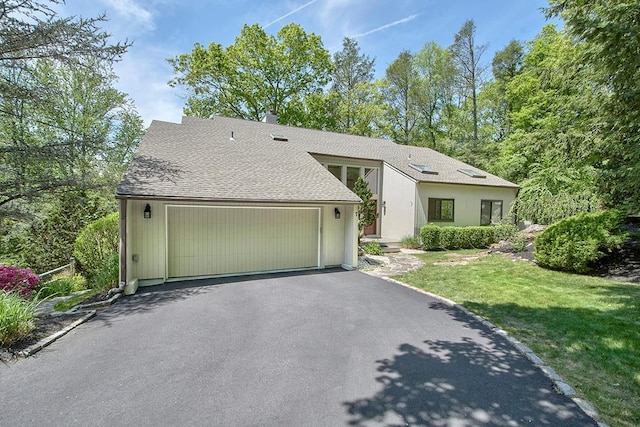 7 High Point Cir, Chappaqua, NY 10514 - mid-century modern home with a front lawn, driveway, a garage, and a shingled roof