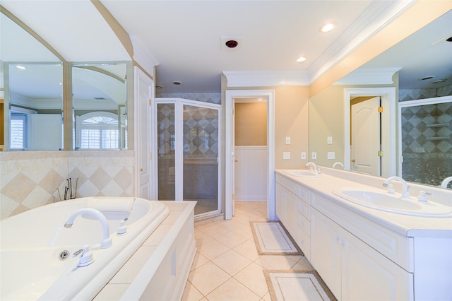 bathroom featuring tile patterned floors, vanity, shower with separate bathtub, and crown molding