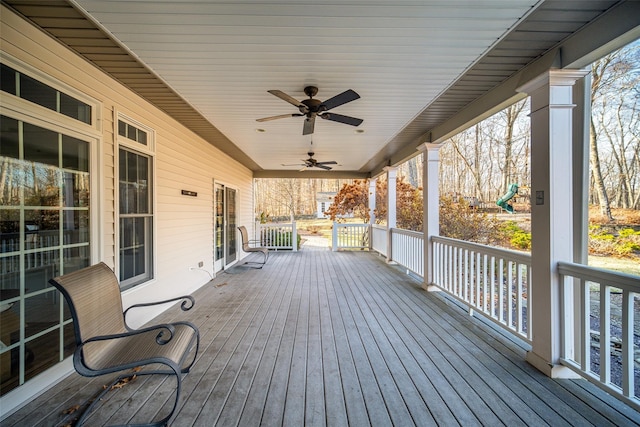 deck with ceiling fan and a porch