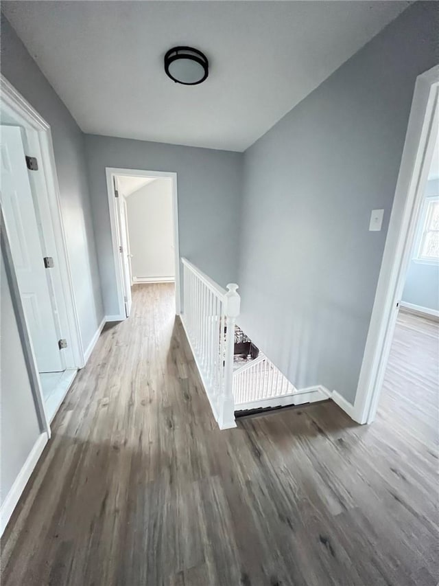 hall with dark hardwood / wood-style flooring