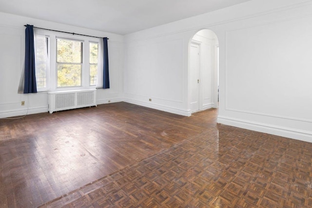 empty room featuring radiator heating unit