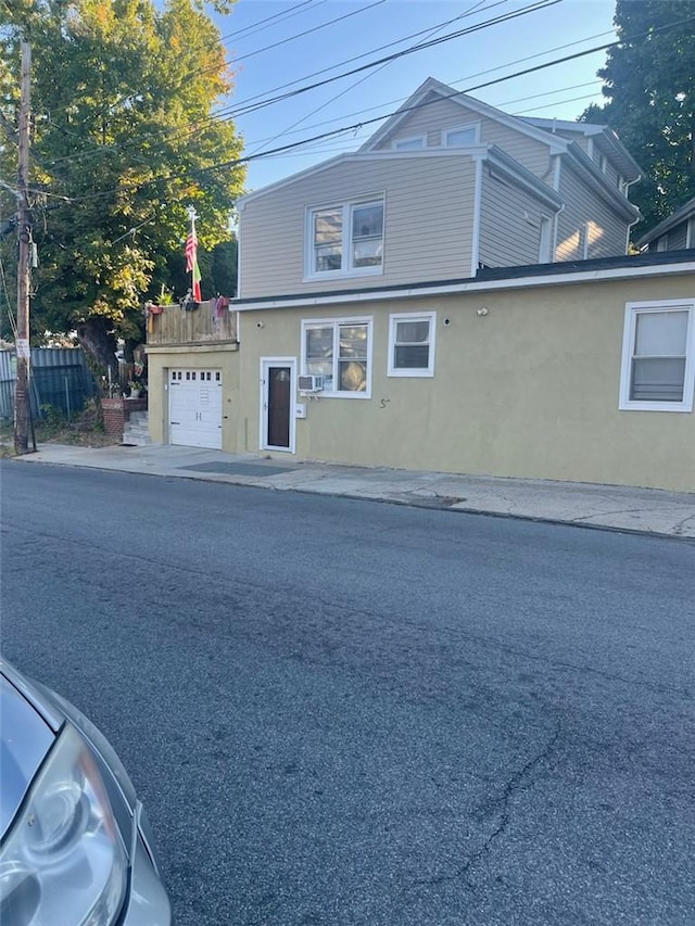 view of side of property featuring a garage