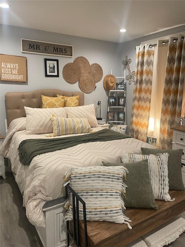 bedroom featuring dark hardwood / wood-style flooring