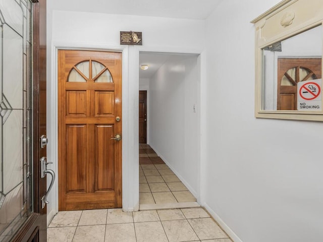 entrance foyer featuring light tile patterned flooring