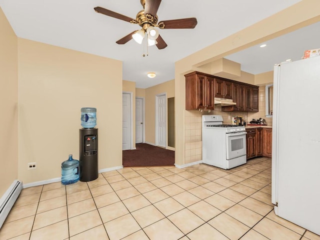 kitchen with ceiling fan, light tile patterned flooring, white appliances, and a baseboard radiator