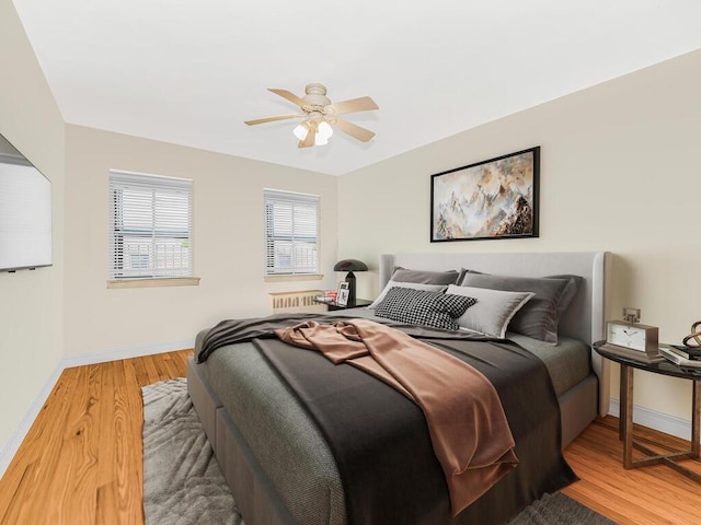 bedroom featuring ceiling fan and hardwood / wood-style floors