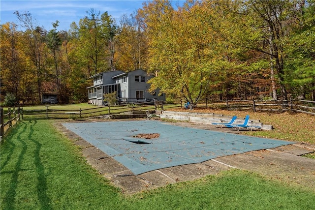 view of pool featuring a yard and a patio