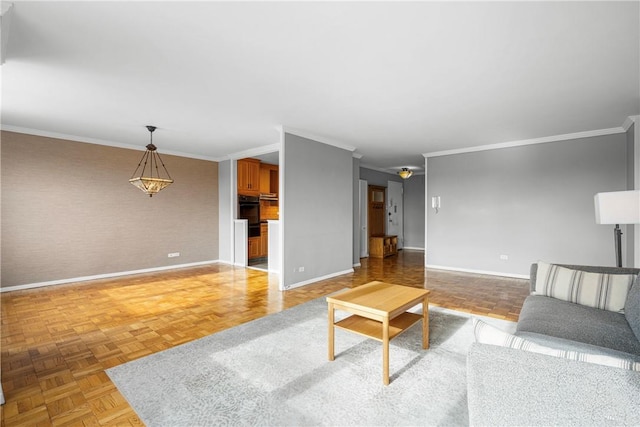 unfurnished living room featuring ornamental molding and light parquet flooring