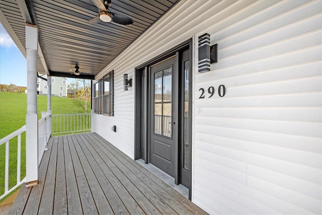 wooden deck featuring ceiling fan and a porch