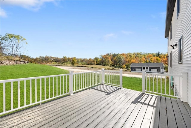 wooden terrace with a lawn