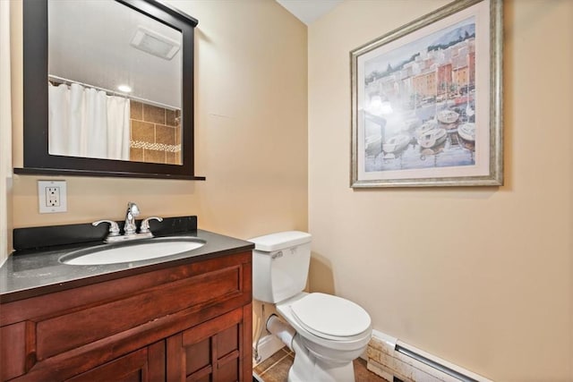 bathroom with a shower with shower curtain, tile patterned floors, vanity, a baseboard heating unit, and toilet