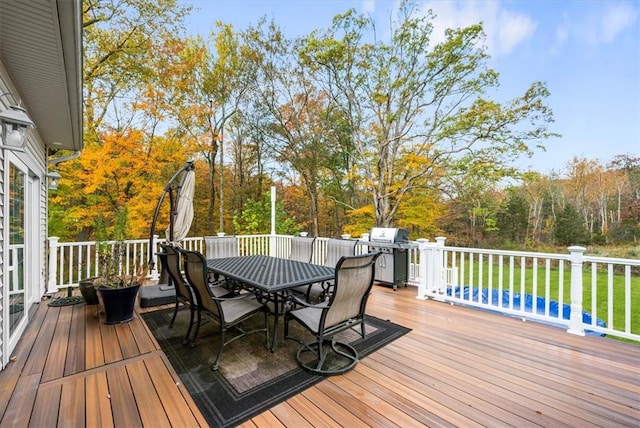 wooden terrace featuring grilling area