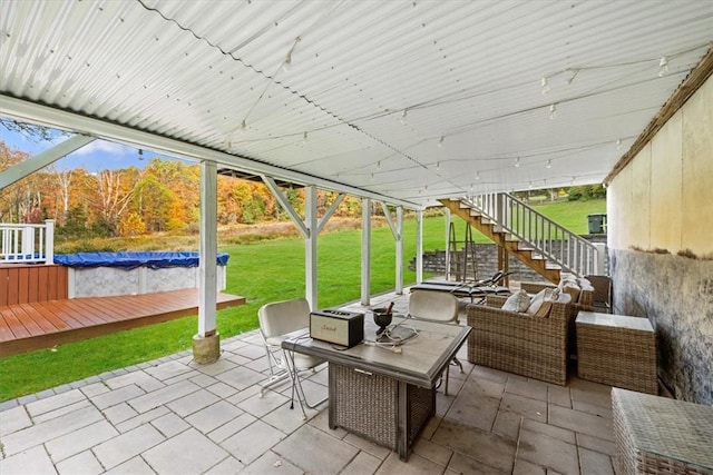 view of patio with outdoor lounge area and a pool side deck