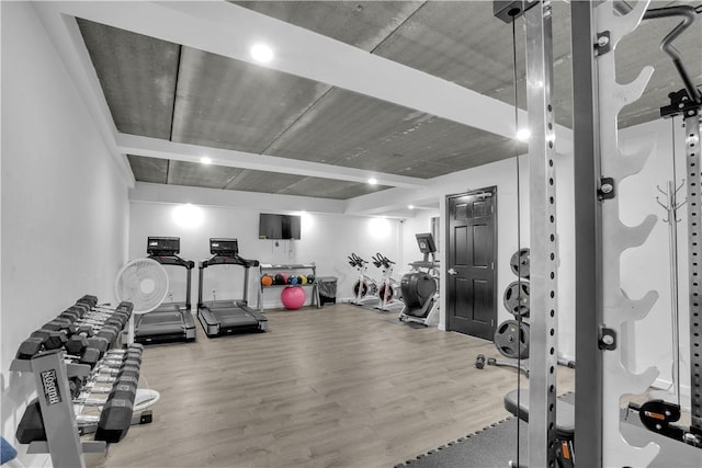 workout area featuring hardwood / wood-style floors