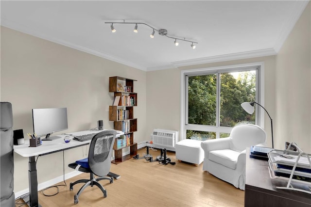 office area featuring a wall mounted air conditioner, light wood-type flooring, and ornamental molding