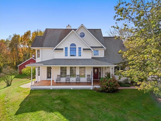 view of front of property with a porch and a front yard