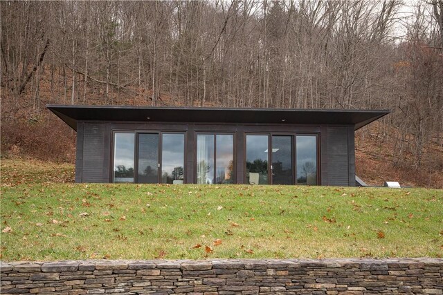 rear view of house with a lawn