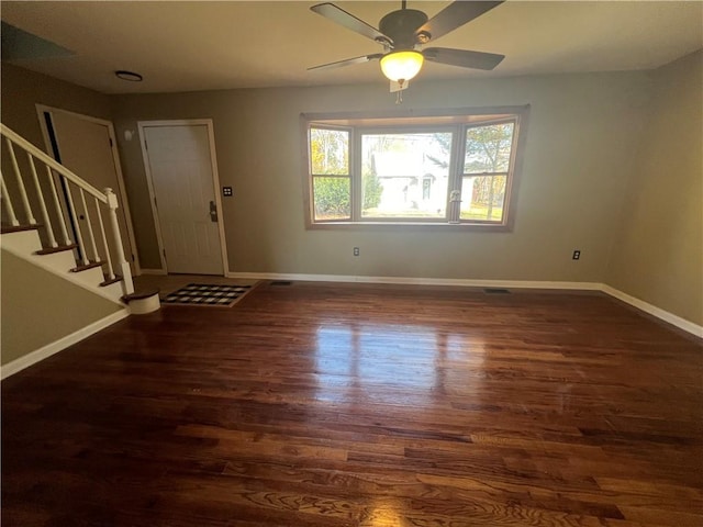 foyer featuring ceiling fan and dark hardwood / wood-style flooring