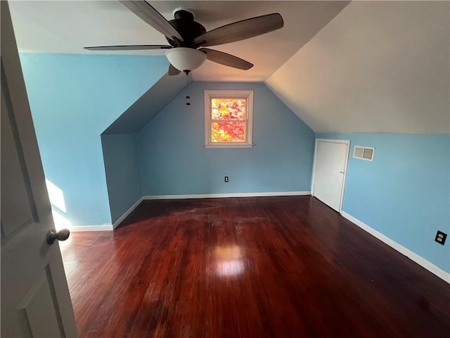 additional living space featuring vaulted ceiling, ceiling fan, and dark hardwood / wood-style floors