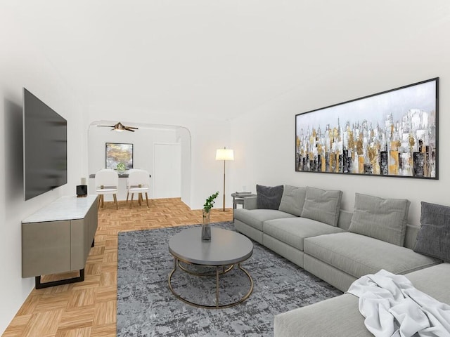 living room with ceiling fan and light parquet floors