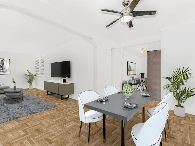 dining room with light parquet flooring and ceiling fan