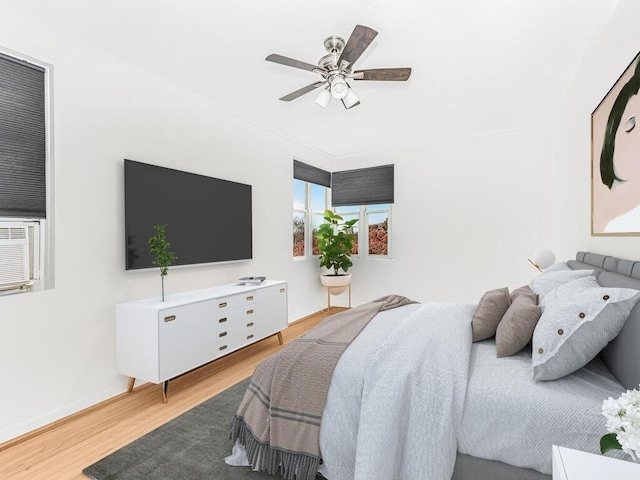 bedroom featuring light hardwood / wood-style flooring and ceiling fan