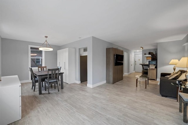 dining space featuring light hardwood / wood-style floors