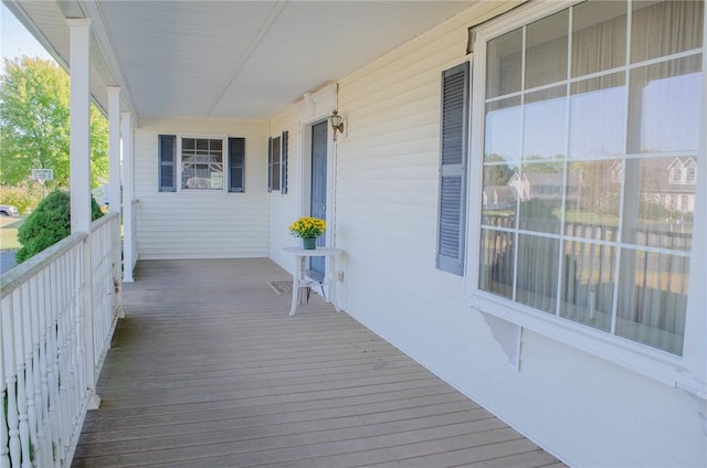 wooden terrace with a porch