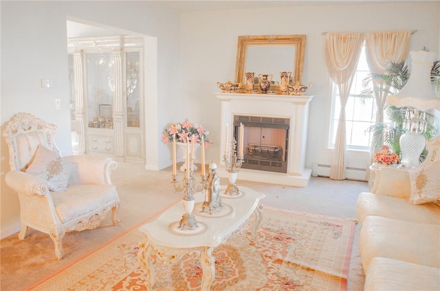 126 Canterbury, Saugerties, NY 12477 - carpeted living area featuring a baseboard radiator and a fireplace with raised hearth