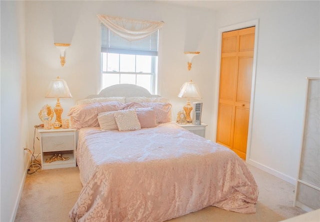 carpeted bedroom featuring a closet