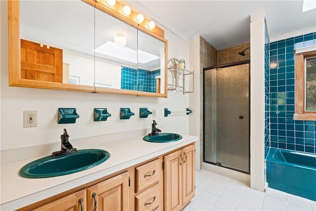 bathroom featuring tile patterned flooring, vanity, and walk in shower