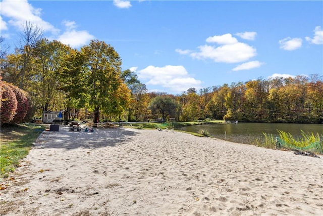 surrounding community featuring a water view