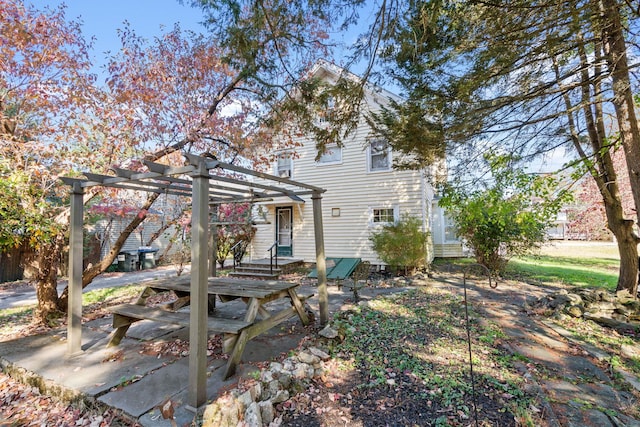 view of front of house with a pergola