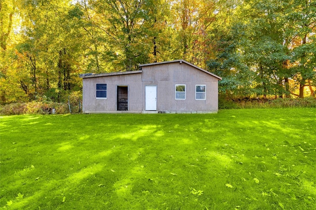 view of outdoor structure with a lawn