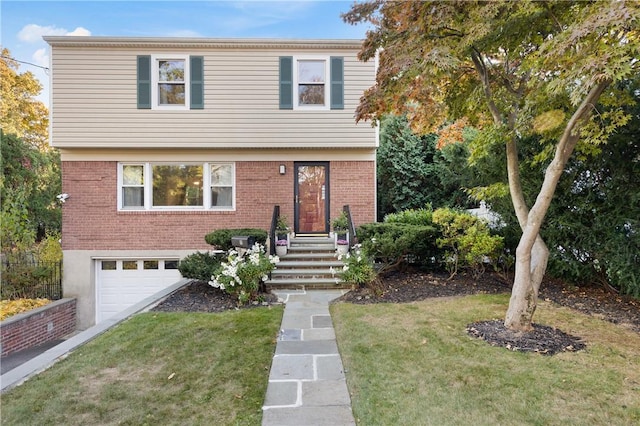 view of front of house featuring a garage and a front yard