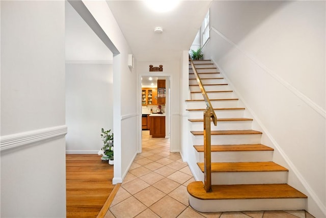 stairs with hardwood / wood-style flooring